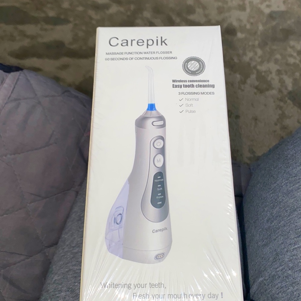 Carepik massage function water flosser. New in pkg